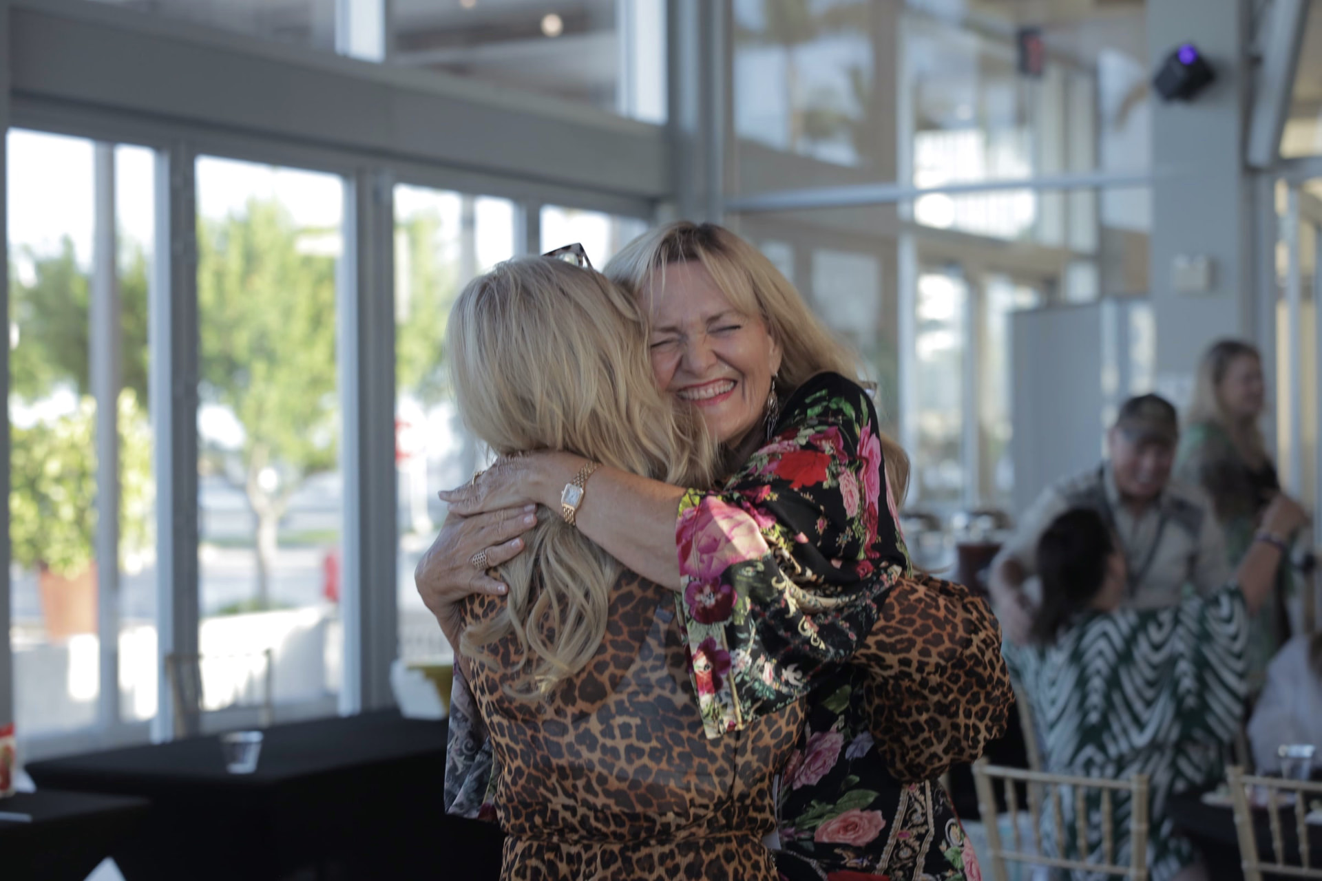 Members of Happiness Circle sharing a warm embrace at a gathering